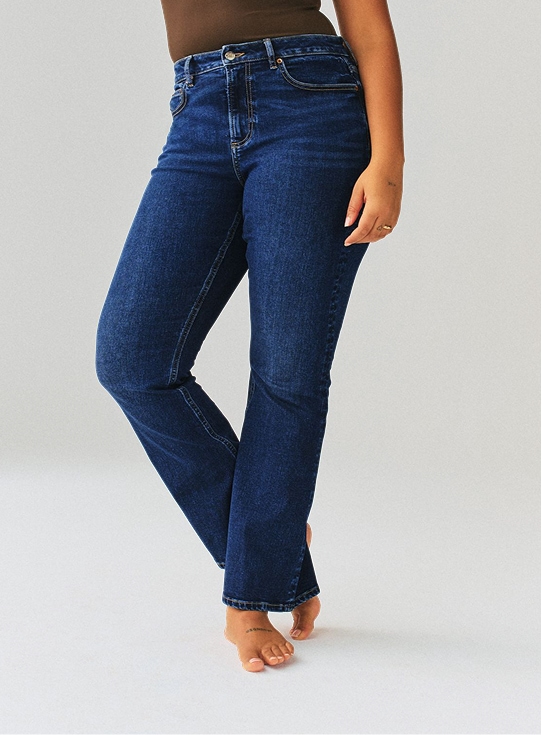 Model wearing dark-wash stretch jeans