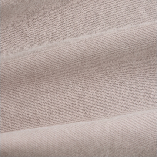 Close-up of neutral stone-coloured denim